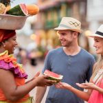 Photo of 2 tourist in Cartagena buying watermelon