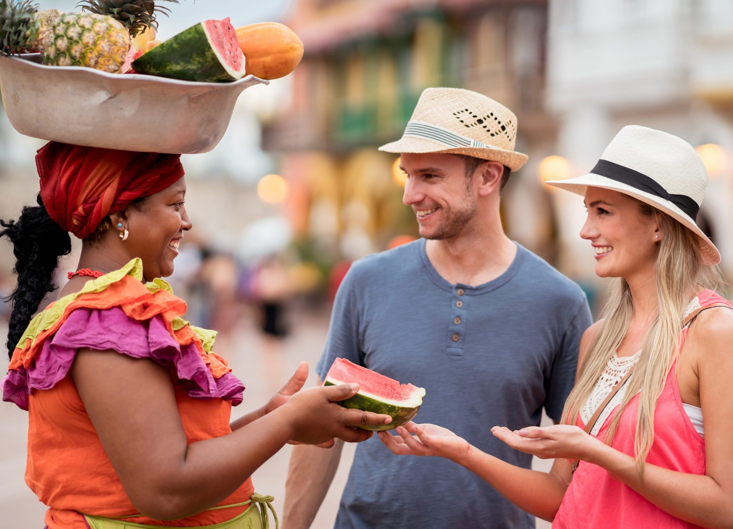 Photo of 2 tourist in Cartagena buying watermelon